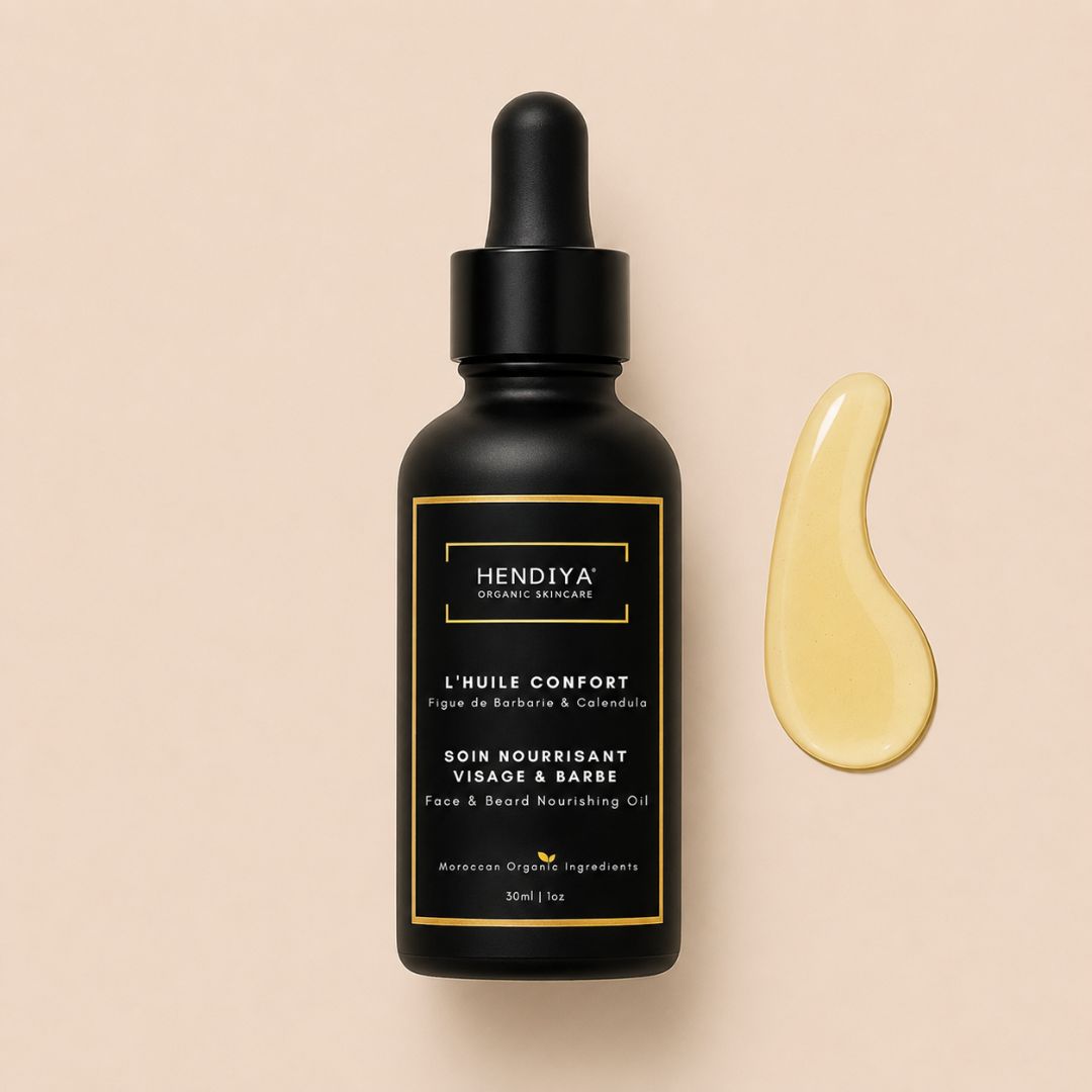 Flacon de L'Huile Confort Hendiya, soin nourrissant visage et barbe pour homme à l'huile de pépins de figue de barbarie et au calendula, flacon noir avec compte-gouttes.